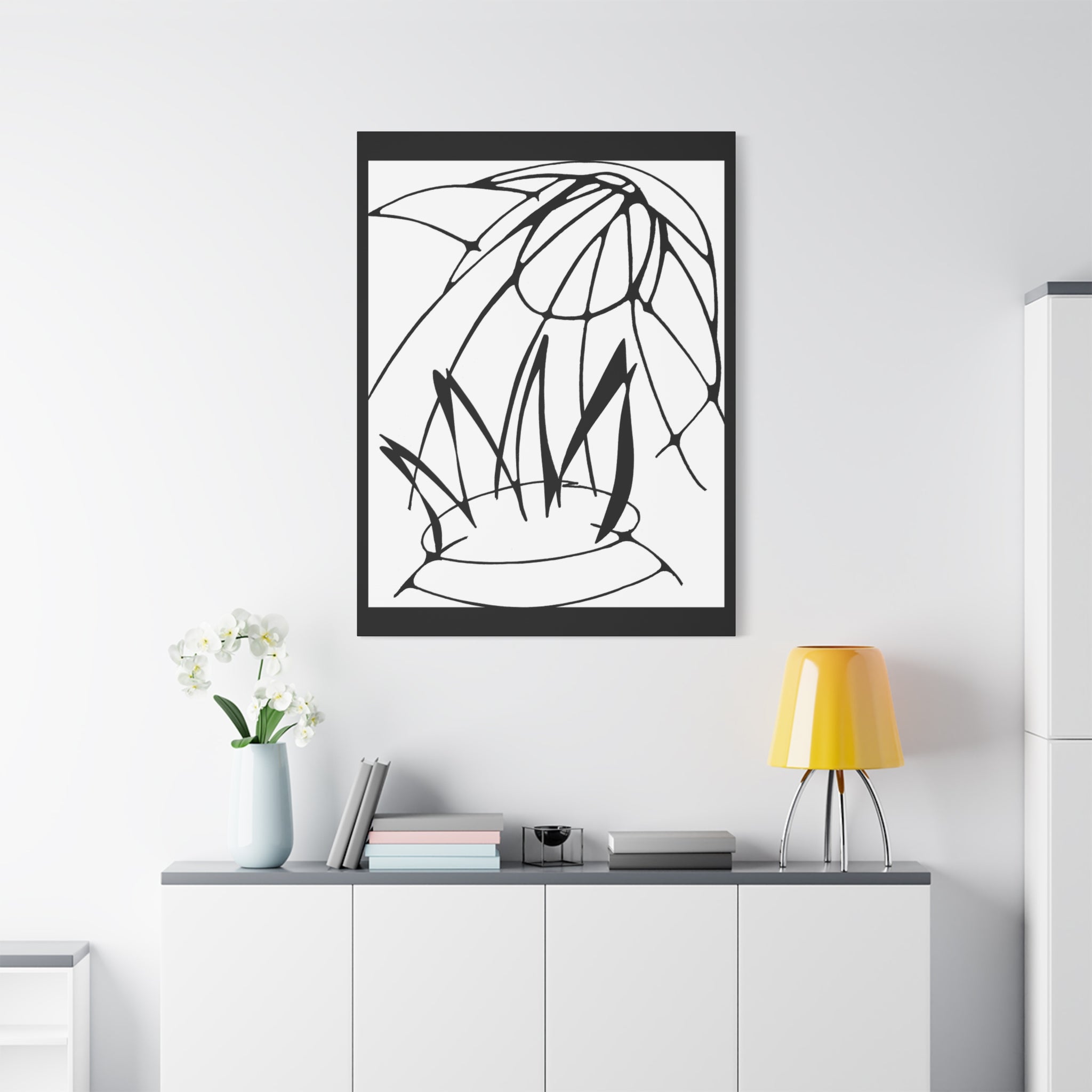 Bird of Prey, an eagle or hawk coming out of a pot of fire. Framed black and white abstract artwork on a white background