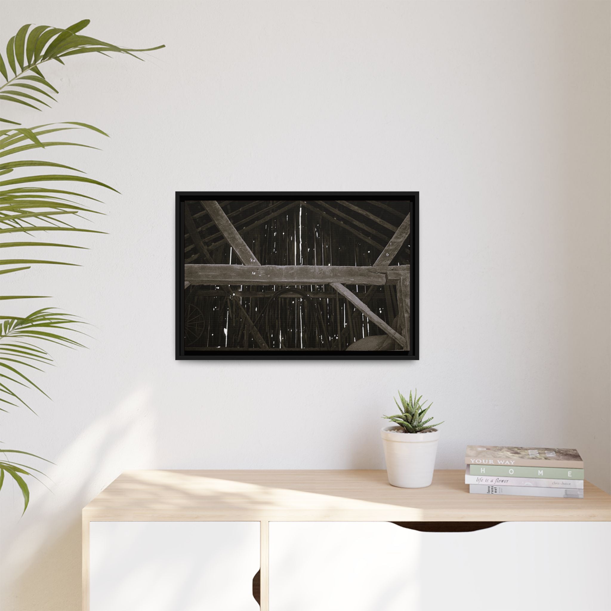 Rustic barn interior framed canvas print — moody looking-up view of weathered wooden beams and rafters with pinpoints of light, farmhouse photography wall art