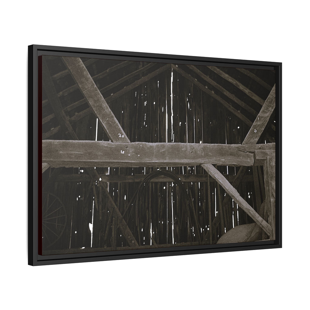 Rustic barn interior framed canvas print — moody looking-up view of weathered wooden beams and rafters with pinpoints of light, farmhouse photography wall art
