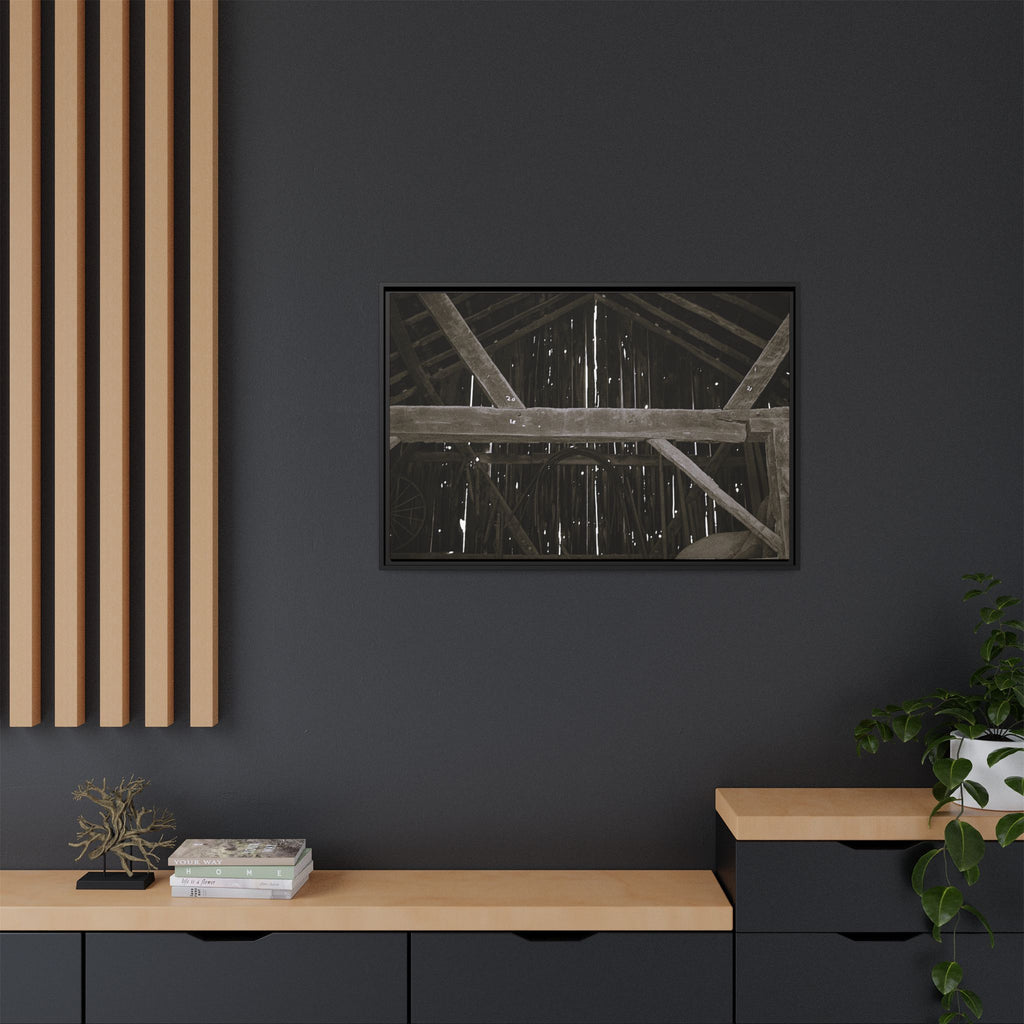 Rustic barn interior framed canvas print — moody looking-up view of weathered wooden beams and rafters with pinpoints of light, farmhouse photography wall art
