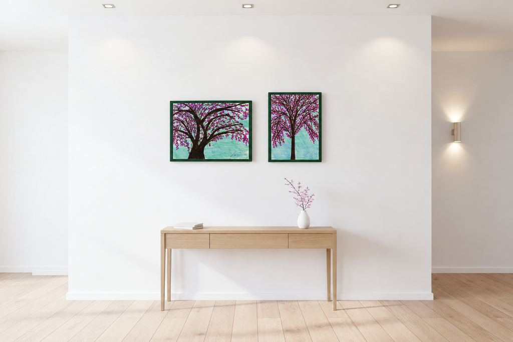 Blossom Tree and Pink Blossom stretched canvases side by side above a light wood console